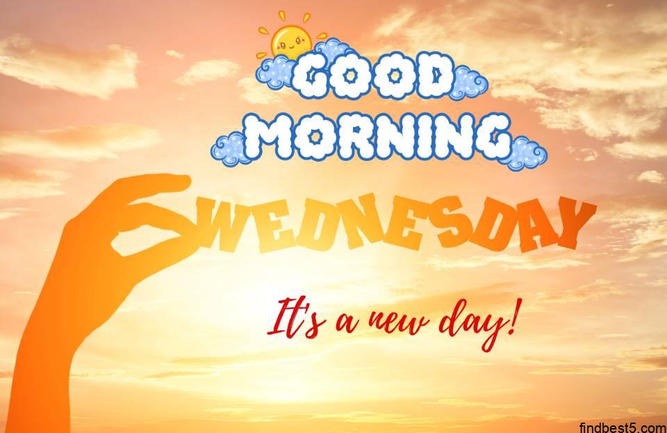 Good morning wednesday images with a hand holding wednesday and yellow sky in background and a quote it's a new day