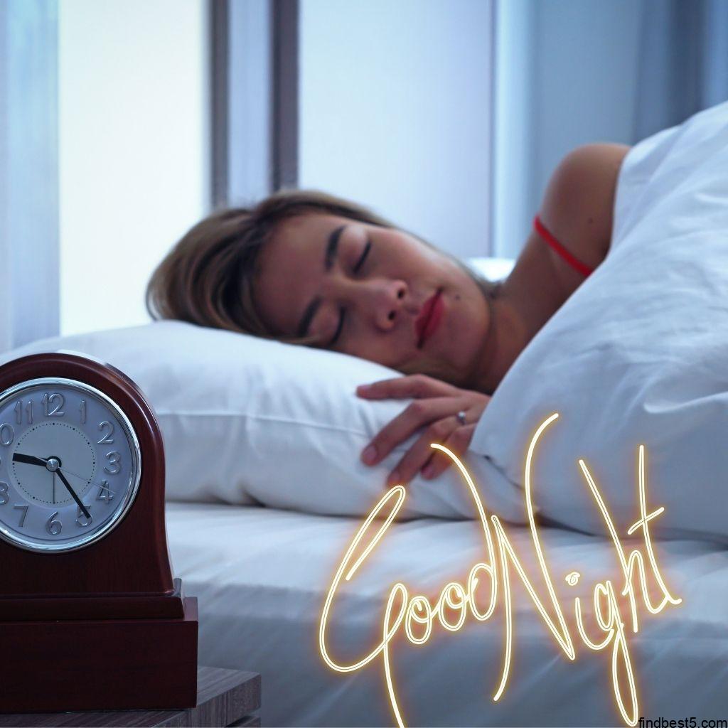 Good night image with a girl sleeping on the bed with a alarm clock